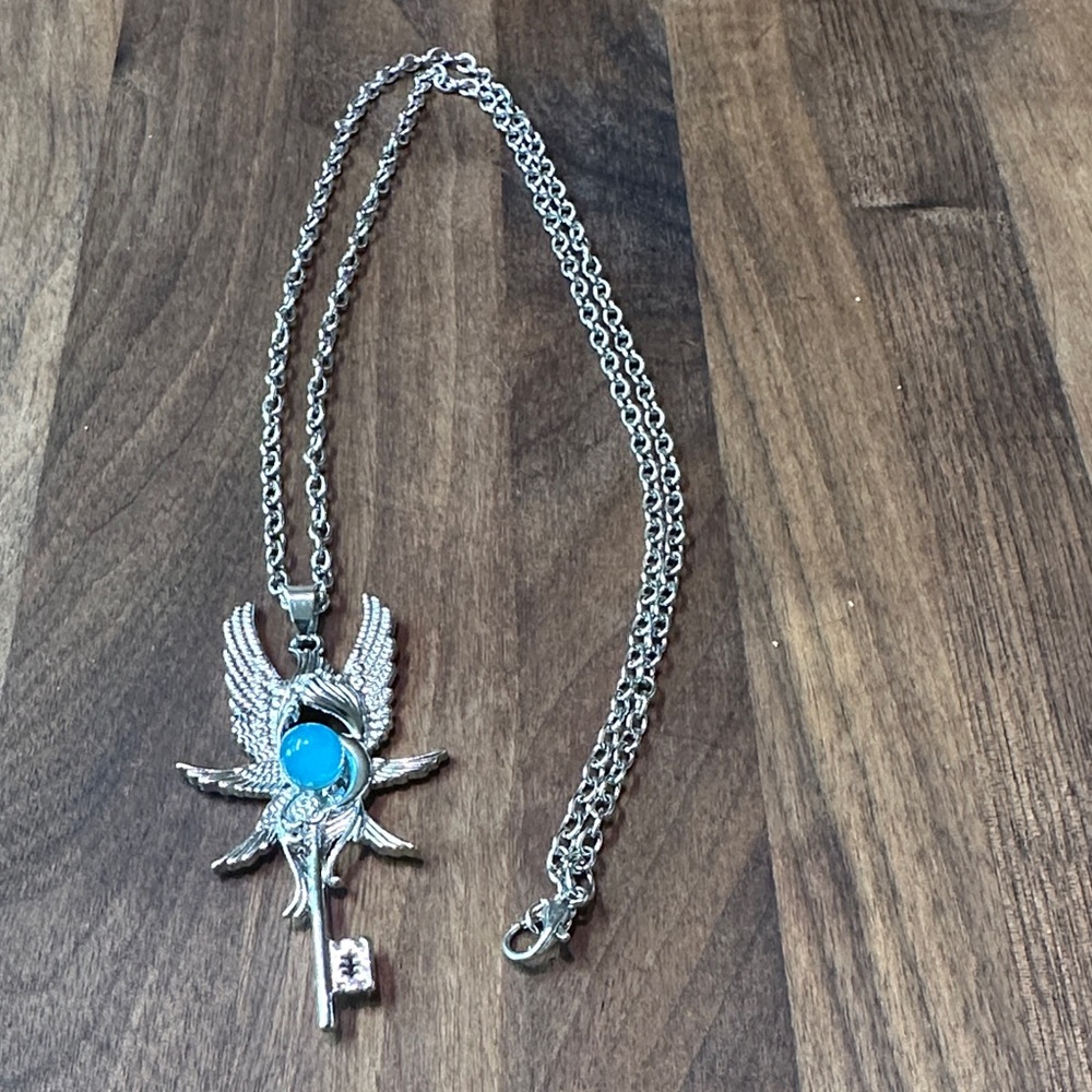 Silver Angel Wing Necklace with Blue Gem